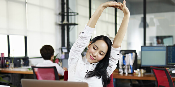 singapore woman embodying a corporate wellness program