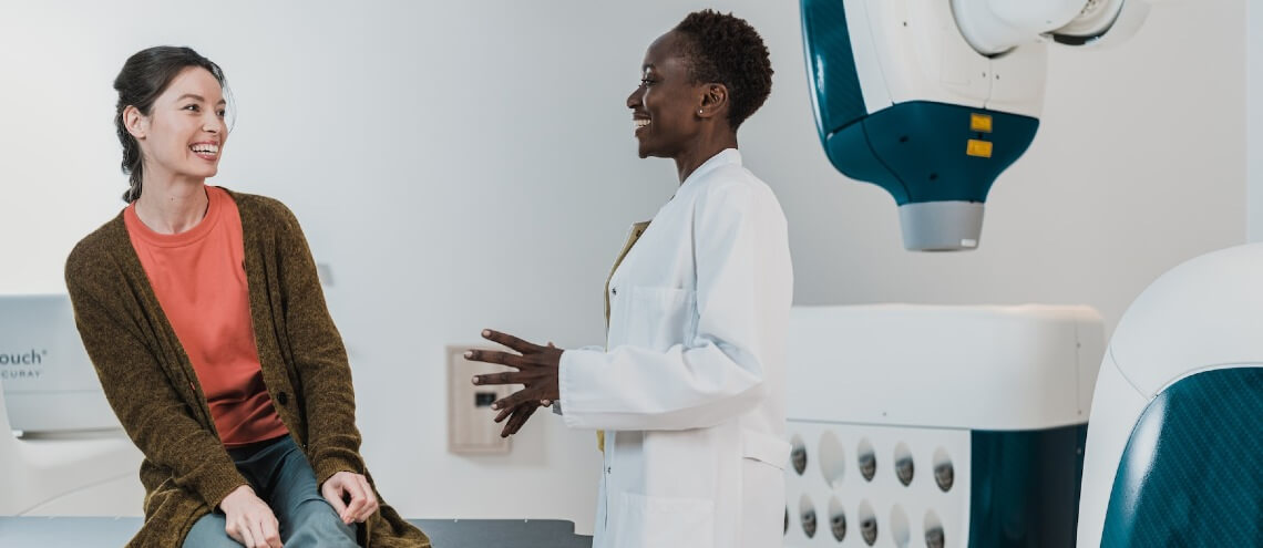 A doctor and her patient talking about the test results after a health screening. 
