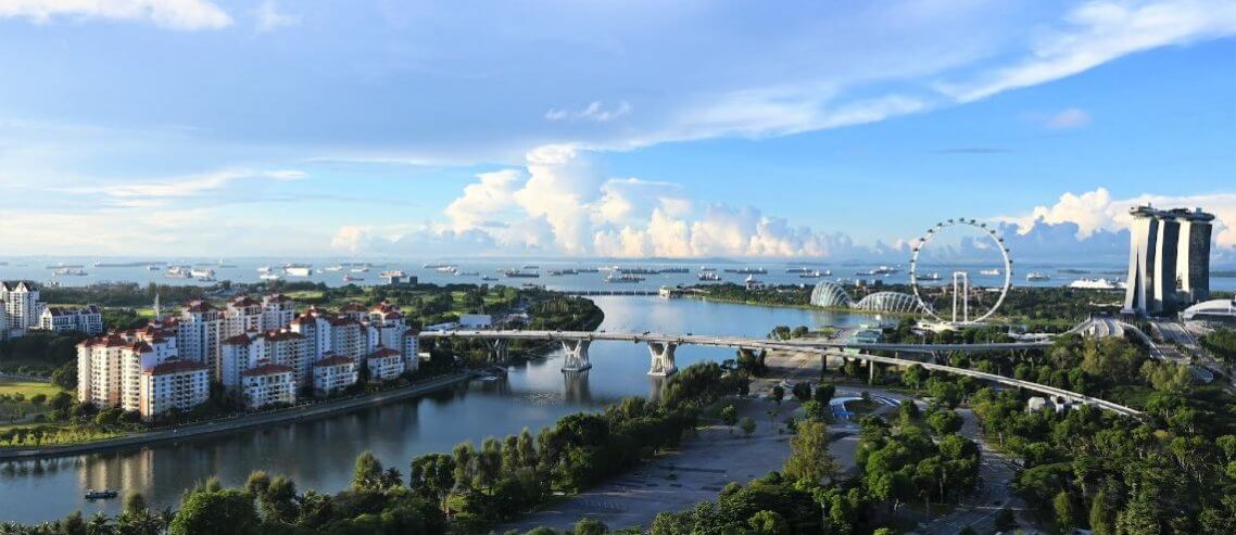 This skyline of the city-state of Singapore, a familiar view to expats here.