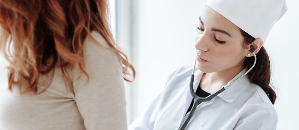 Doctor checking her outpatient's health.