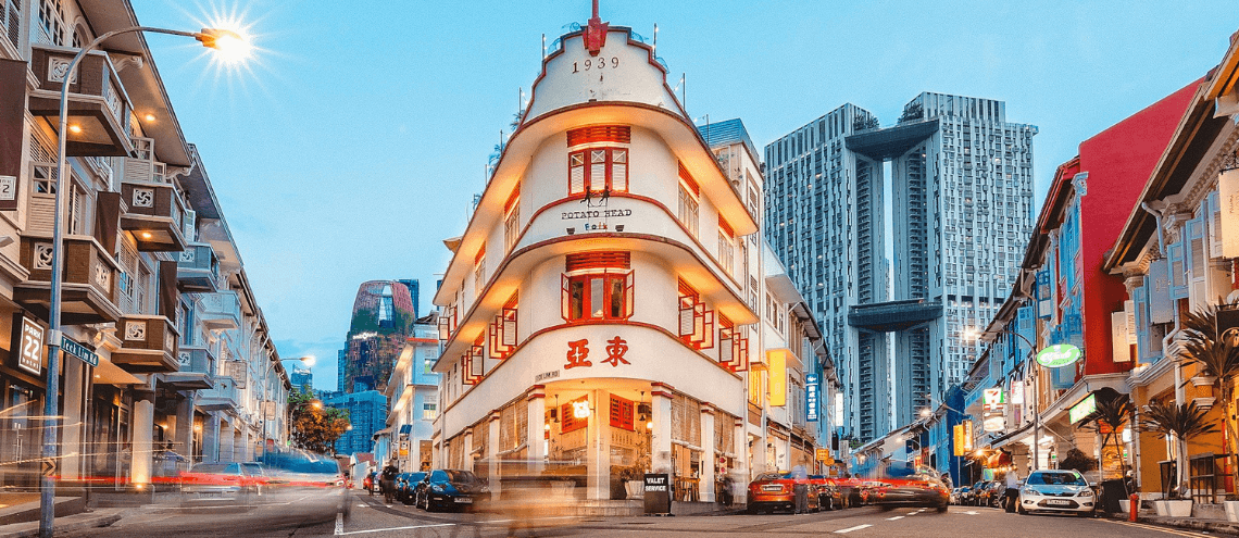 city with cars and road during daytime in Singapore