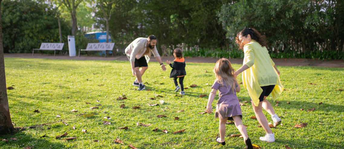a family enjoying their time together in a park